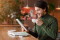 Happy businessman reading news while drinking morning coffee Royalty Free Stock Photo