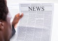 Happy businessman reading newspaper Royalty Free Stock Photo