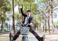 Happy Businessman riding bicycle to work on urban street Royalty Free Stock Photo