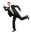 Happy businessman runs in black suit on white. Royalty Free Stock Photo