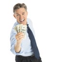 Happy Businessman Showing Dollar Bills Over White Background