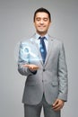 Happy businessman showing virtual projection Royalty Free Stock Photo