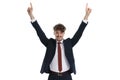 Happy businessman smiling and pointing up with both hands Royalty Free Stock Photo