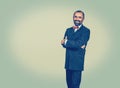 Happy businessman standing with crossed arms Royalty Free Stock Photo