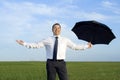 Happy businessman standing with umbrella Royalty Free Stock Photo