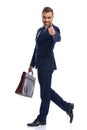 happy businessman in suit making thumbs up sign and smiling Royalty Free Stock Photo