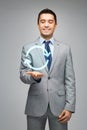 Happy businessman in suit showing circle arrow