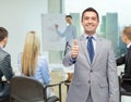 Happy businessman in suit showing thumbs up Royalty Free Stock Photo