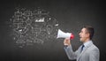 Happy businessman in suit speaking to megaphone Royalty Free Stock Photo