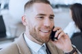 Happy businessman talking on cellphone at the airport waiting lounge. Handsome caucasian businessman at waiting room in Royalty Free Stock Photo