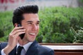Happy businessman talking on phone outside the office Royalty Free Stock Photo