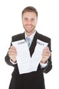 Happy businessman tearing contract paper Royalty Free Stock Photo