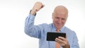 Happy Businessman Use Tablet Read Good Financial News Make Victory Hand Gestures