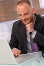 Happy businessman using laptop Royalty Free Stock Photo