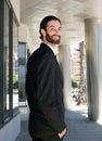 Happy businessman walking in the city outside office building Royalty Free Stock Photo