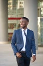 Happy businessman walking in the city Royalty Free Stock Photo