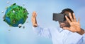 Happy businessman wearing VR glasses while gesturing by low poly earth