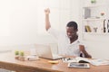 Happy businessman win. Winner, black man in office Royalty Free Stock Photo