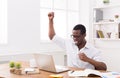 Happy businessman win. Winner, black man in office Royalty Free Stock Photo