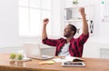 Happy businessman win. Winner, black man in office Royalty Free Stock Photo