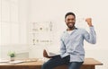 Happy businessman win. Winner, black man in office Royalty Free Stock Photo