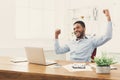 Happy businessman win. Winner, black man in office Royalty Free Stock Photo