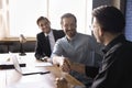 Happy businessmen making deal shake hands finish formal meeting