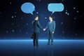 Happy businessmen with speech bubbles shaking hands on blurry squares blue background. Technology, metaverse, teamwork and success Royalty Free Stock Photo