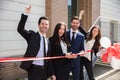 Happy Businesspeople Cutting Ribbon Royalty Free Stock Photo