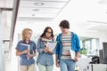 Happy businesspeople discussing while walking in creative office Royalty Free Stock Photo