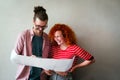 Happy businesspeople laughing while collaborating on a new project in an office. Business startup. Royalty Free Stock Photo