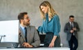 Happy businesspeople laughing while collaborating on a new project in an office. Royalty Free Stock Photo