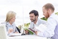 Happy businesspeople reading menu at sidewalk cafe Royalty Free Stock Photo