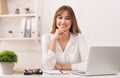 Happy Businessswoman Sitting At Laptop Smiling In Modern Office