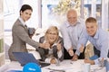Happy businessteam giving thumbs up at work Royalty Free Stock Photo