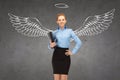 Happy businesswoman with angel wings and nimbus Royalty Free Stock Photo