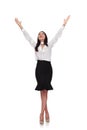 Happy businesswoman celebrates and looks up while standing cross