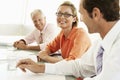 Happy Businesswoman With Colleagues In Conference Room Royalty Free Stock Photo