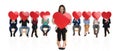 Happy businesswoman in front of a large team holding heart