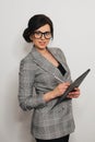Happy businesswoman girl with documents in business suit with glasses