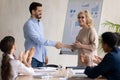 Happy businesswoman handshake greeting employee with promotion Royalty Free Stock Photo