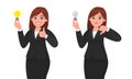 Happy businesswoman holding bright light bulb and showing thumbs up sign. Unhappy woman holding bulb and gesturing thumbs down.