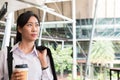 Businesswoman holding coffee outside office building. beautiful Royalty Free Stock Photo