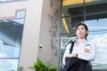 Businesswoman holding coffee outside office building. beautiful Royalty Free Stock Photo