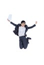 Happy businesswoman jumping with a paper