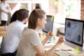 Happy businesswoman looking at screen, clenching fists Royalty Free Stock Photo