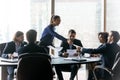 Happy businesswoman manager gives handout in boardroom at meeting. Royalty Free Stock Photo