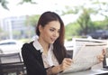 Happy businesswoman reading newspaper and smile Royalty Free Stock Photo