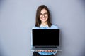 Happy businesswoman showing blank laptop screen Royalty Free Stock Photo