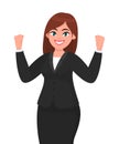 Happy businesswoman showing or raising her fists expressing success gesture. Businesswoman`s emotion and body language concept.